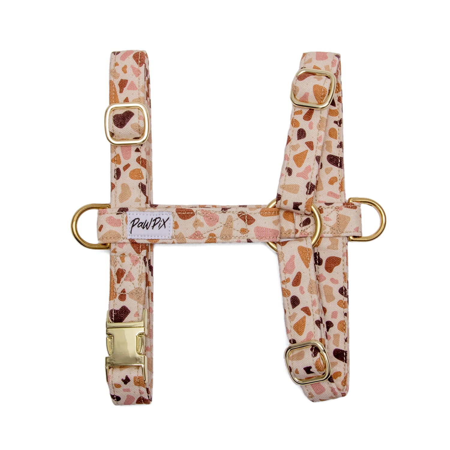 Harnais en H pour chien Pawpino : Motif terrazzo graphique avec des tons marron/rose. Le harnais comporte une boucle anti-traction pour les chiens les plus fougueux. 