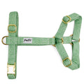 Harnais en Y pour chien Topo : Motif nature blanc sur fond vert. Les boucles du harnais sont couleur or