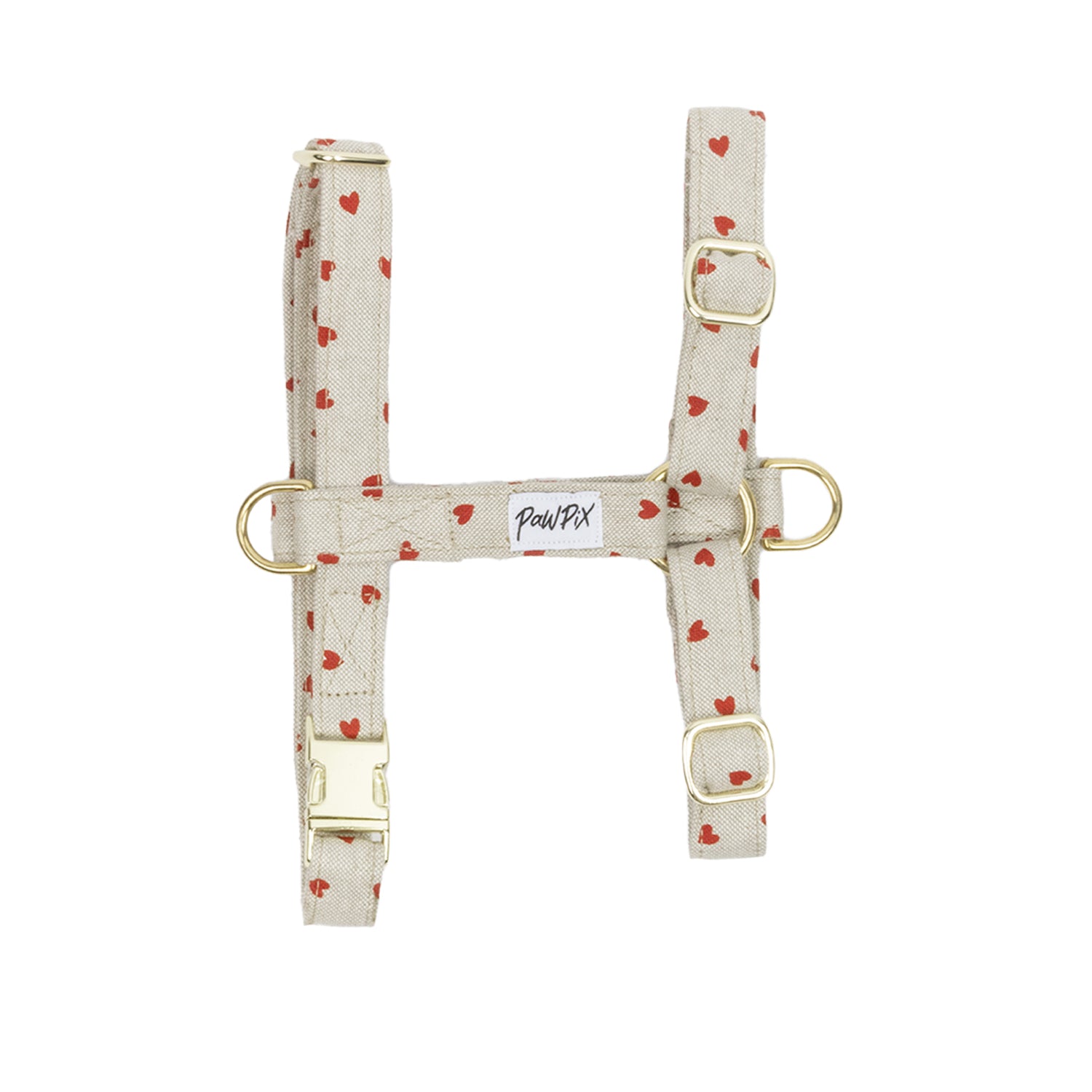 Harnais My Valentine  vue à plat. Les boucles sont de couleur or clair et le design présente de petits cœurs rouges sur un fond beige clair.