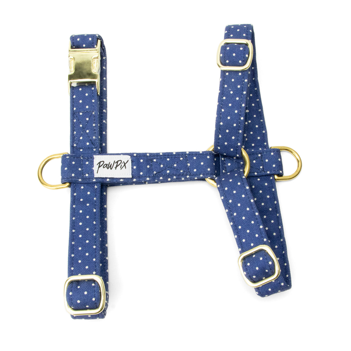 Harnais pour chien Polaris. Design bleu marine avec des pois blancs. Le harnais comprends 3 boucles de serrage, 2 anneaux en D et une boucle clips pour fermer le harnais