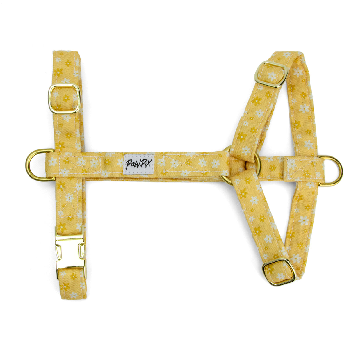 Harnais pour chien Peachy Daisies et son motif marguerites blanches et jaunes sur fond couleur pêche. Harnais en H possèdant une boucle anti-traction et un anneau D,  4 boucles de reglages, et une boucle clips. Le harnais est disponible en 4 tailles et est fabriqué en France