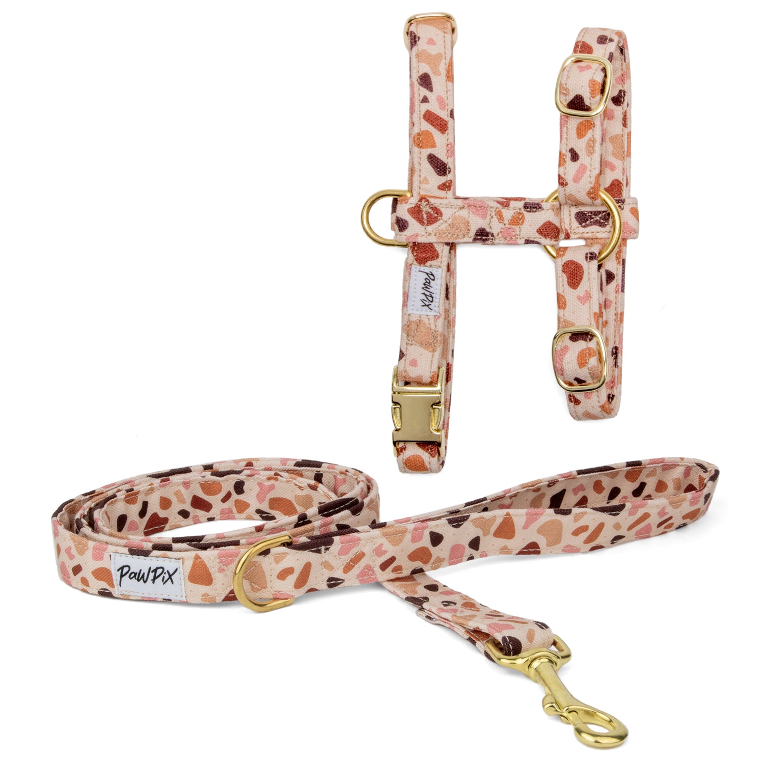 Kit harnais pour chat Pawpino . Le kit comprend une laisse d'1m20 de longueur et un harnais en H disponible en 2 tailles différentes pour chat et grand chat. 
Le design Pawpino représente un terrazzo italien de couleur rose/marron