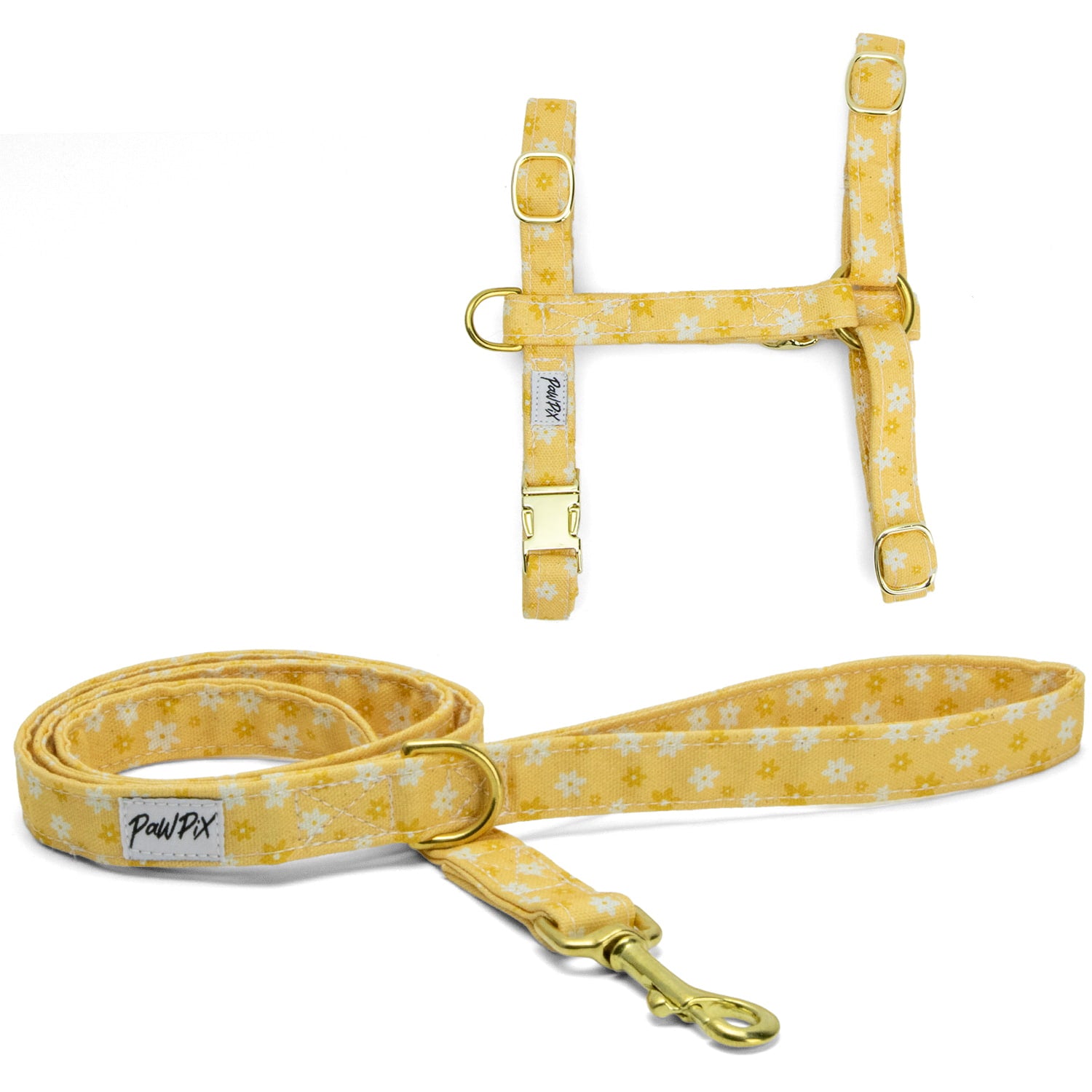 Kit harnais pour chat Peachy Daisies avec son motif marguerites blanches et jaunes sur fond couleur pêche. Le kit comprend un harnais en H avec 4 boucles de reglages, et une laisse d'1m20 