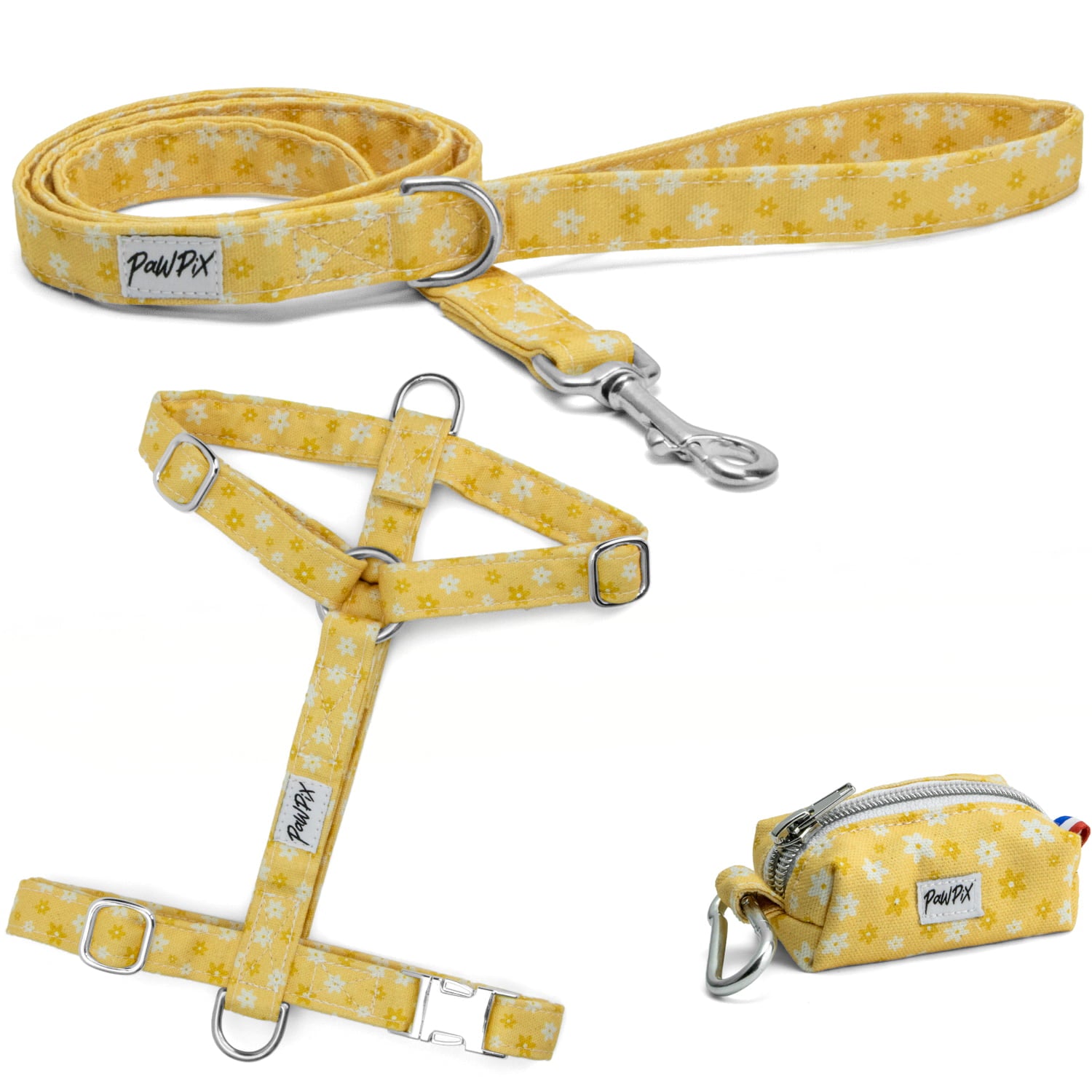 Kit harnais pour chien Peachy Daisies avec ses boucles en argent. Le kit propose un harnais pour chien en H (disponible en 4 tailles), une laisse d'1m20 et une pochette sacs à crottes, le tout avec un motif marguerites blanches et jaunes sur fond couleur pêche. 