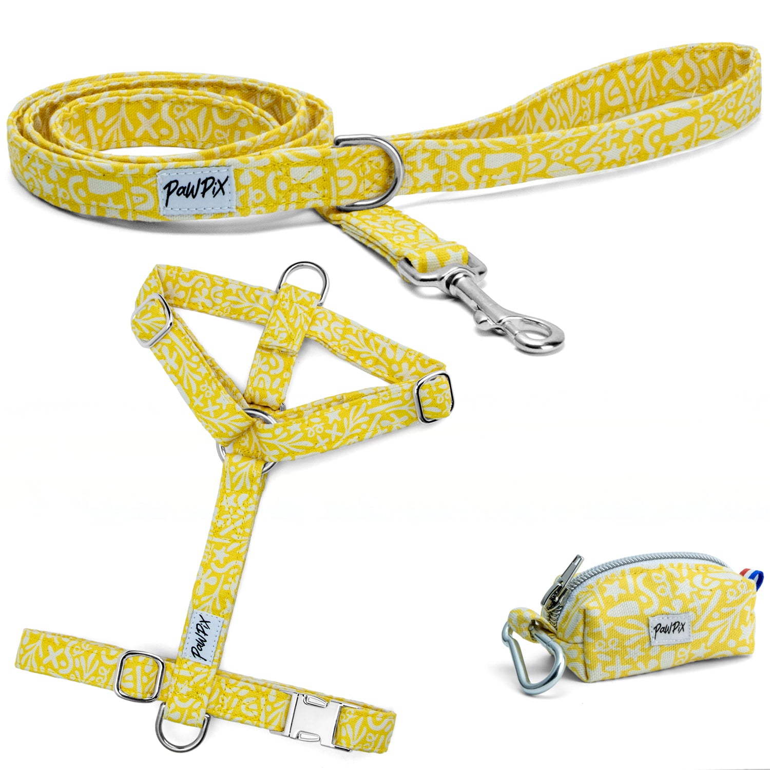 Kit harnais pour chien Seaside avec ses boucles couleur argent. Le kit propose un harnais pour chien en H (disponible en 4 tailles), une laisse d'1m20 et une pochette sacs à crottes, le tout avec un motif marin abstrait blanc sur fond jaune solaire
