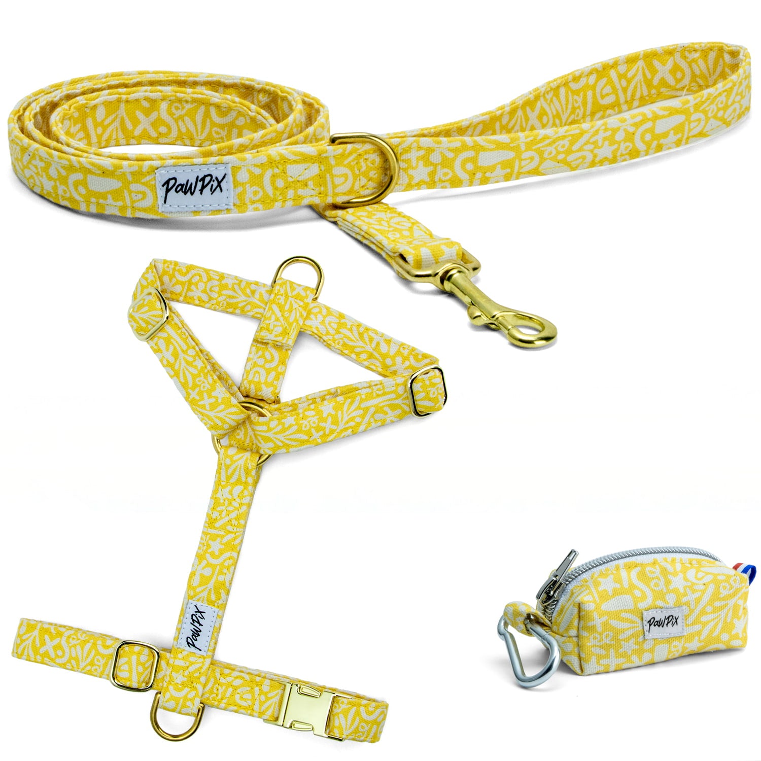 Kit harnais pour chien Seaside avec ses boucles couleur argent. Le kit propose un harnais pour chien en H (disponible en 4 tailles), une laisse d'1m20 et une pochette sacs à crottes, le tout avec un motif marin abstrait blanc sur fond jaune solaire