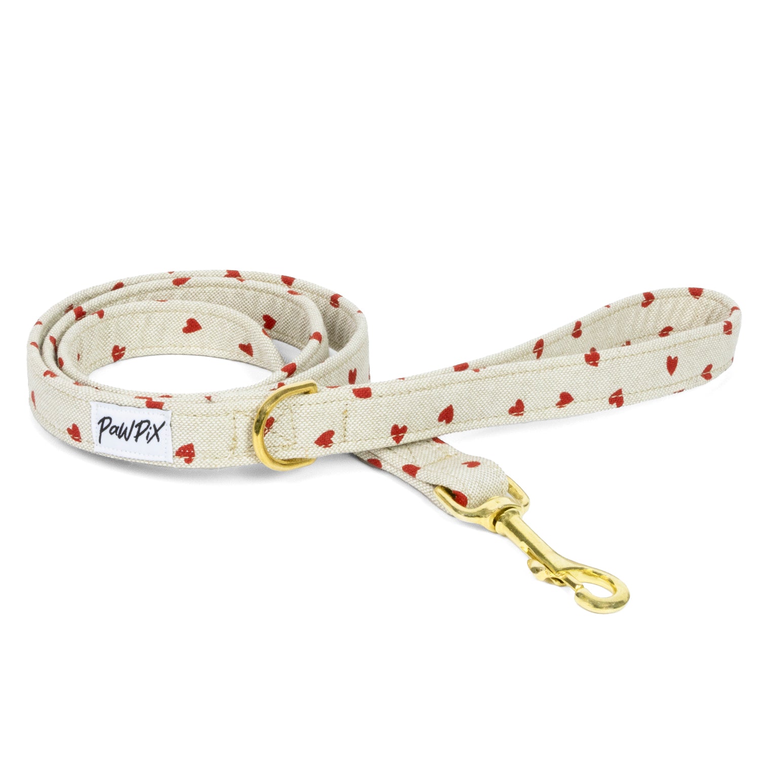Laisse My Valentine avec en design des coeurs rouges sur un fond beige clair. La bouclerie est couleur or clair. 