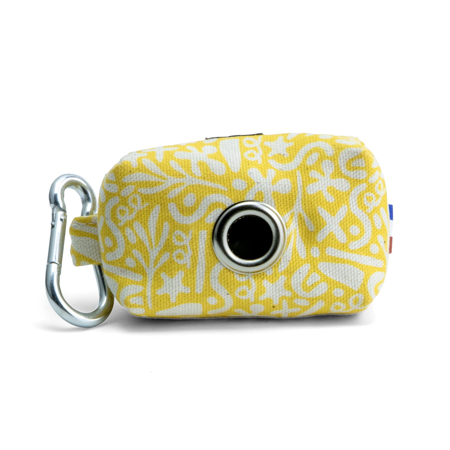 Arrière de la pochette sacs à crottes Seaside  avec son motif marin abstrait blanc sur fond jaune solaire. L'arrière de la pochette possède un œillet assez large pour passer les sacs à crottes, ainsi qu'un mousqueton pour accrocher la pochette à une laisse ou autre accessoire