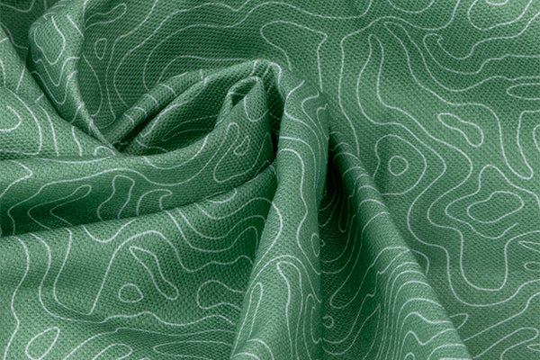 Gros plan sur le tissu Topo qui sert à la réalisation des accessoires pour chien et chat de la gamme Topo